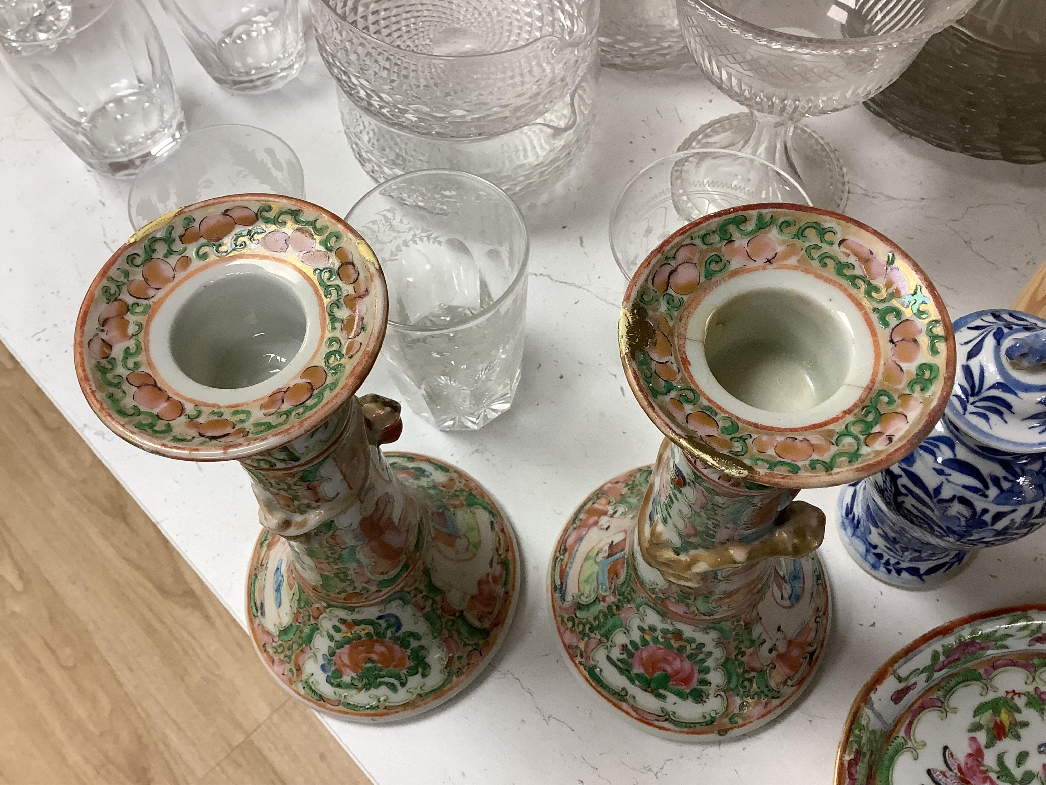 A collection of 19th century Chinese porcelain to include a pair of famille rose candlesticks, dish and a pair of blue and white baluster vases and covers